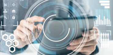 Modern Computing In Business Analytics. Businessman Hand Touchin Modern computing in business analytics. Businessman hand touching virtual screen. Online project management and business intelligence. Statistic diagrams visualization and financial growth concept